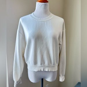 Woman’s ivory cream, long sleeve, crewneck sweatshirt